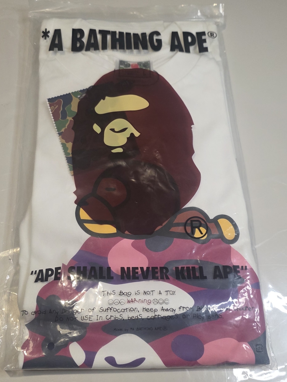 A Bathing Ape White Short Sleeve Tee with Multicolor Ape Graphic